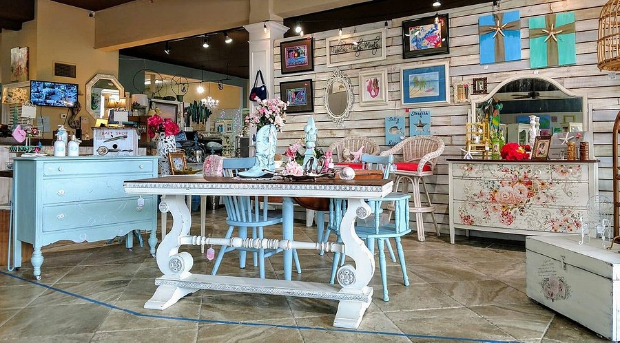 A display of light coastal furniture, art, and other home furnishings inside the store "Coastal Cottage" on St. Pete Beach.